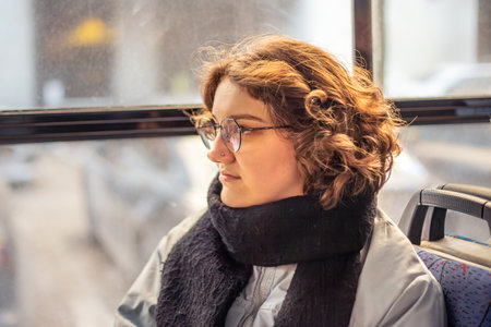 A female student rides public transport. Public transportation and people concept.の写真素材