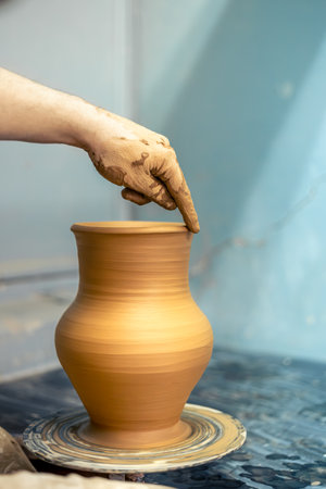 Pottery. Jug on a potters wheel. Ceramics workshop.の写真素材