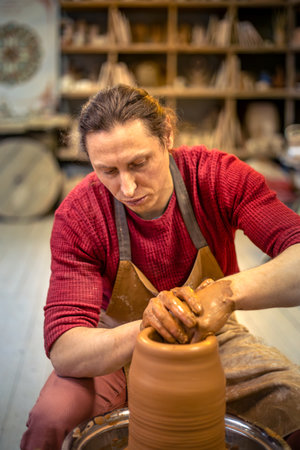A person is making a vase. Pottery. Clay modeling. Making ceramics.の写真素材
