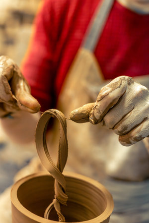 A male potter is making a vase. Pottery. Clay modeling. Making ceramics.