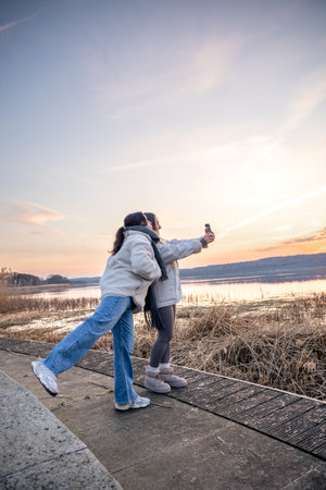 Walk along the promenade. A walk by the sea. Walking in nature. Sunset.の写真素材