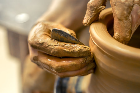 Close-up of male potters hands making a vase.の写真素材