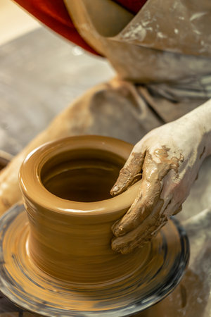 Close-up of male potters hands making a vase. Pottery. Making ceramics.の写真素材