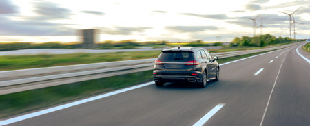 Car on the road. Sunset sky. Forward motion