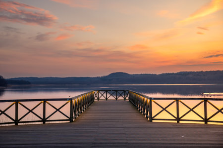 Sunset over the pier at the lake. Pier. Berth. Quay.の写真素材