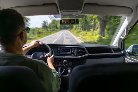 Driving on country road. Car interior view. Summer travel.の写真素材
