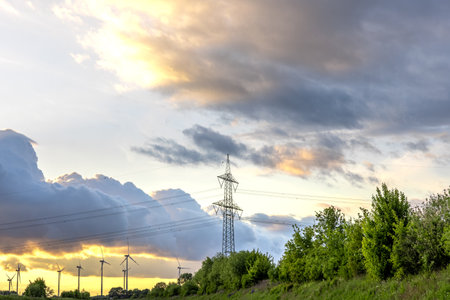 Power tower and windmills. Energy landscape. Sunset sceneの写真素材