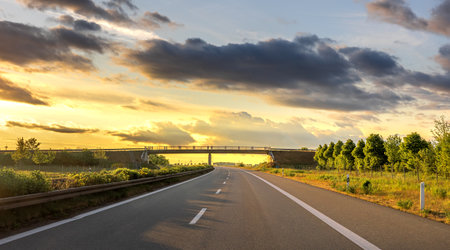 Road to bridge. Sunset highway. Nature and structureの写真素材