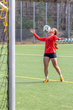 Girl on the soccer field. Soccer training. Active lifestyle. Football concept.の写真素材