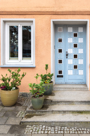 Modern decorative door. Geometric design. Pastel urban facade.の写真素材
