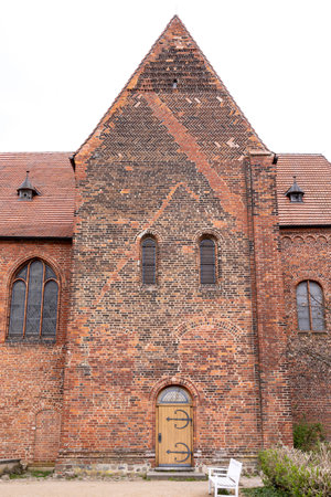 Gothic church with spire. Brick architecture. Historic temple.の写真素材