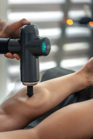 Deep percussive pressure on calf. Cone head.の写真素材