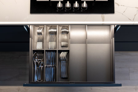 Drawer with cutlery. Modern kitchen. Integrated organization.の写真素材