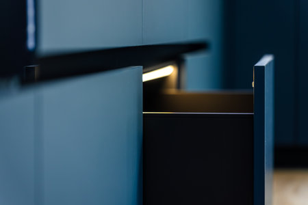 Open drawer. Linear perspective. Dark interiorの写真素材