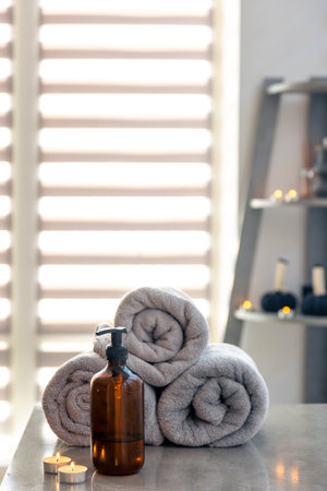 Cozy spa corner with candles and towelsの写真素材