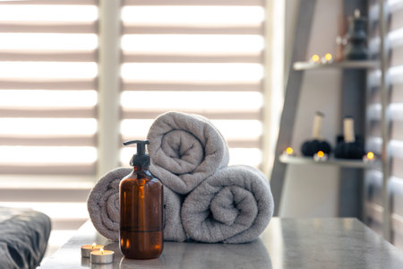 Spa essentials with towels and candles. Minimalist vibeの写真素材