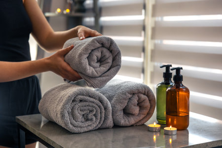 Preparing clean spa towels for client. Comfort and orderの写真素材
