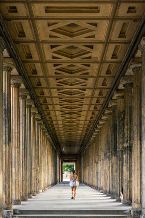 Walk through a sunlit colonnade. Classical colonnade.の写真素材