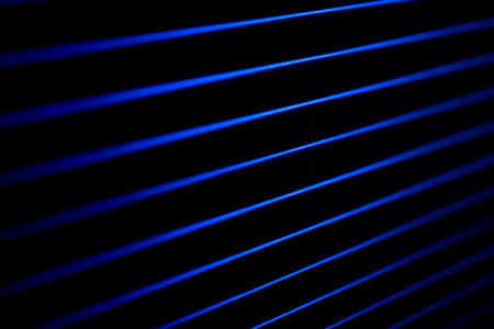 Blue neon lines in deep shadow. Cyberpunk background.の写真素材
