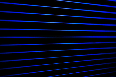 Blue neon lines like digital waves. Neon geometry.