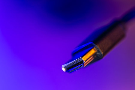 Macro hdmi connector in neon gradient. Video cable closeup.