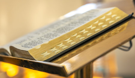Open Bible on a lectern in warm silence. Sermon preparation.の写真素材
