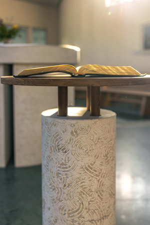 Open Bible on a stand in sun rays. Light and faith.の写真素材