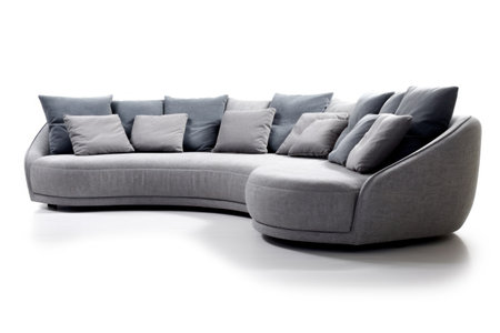 Comfortable gray sofa with pillows isolated on a white background.の素材