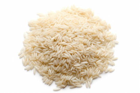 Pile of uncooked rice isolated on white background. Top view.の素材