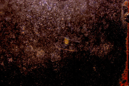 dark old scary rusty rough golden and copper metal surface texture/background for Halloween or haunted house games background/texture of wallの写真素材