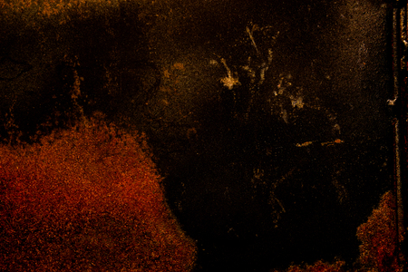 dark old scary rusty rough golden and copper metal surface texture/background for Halloween or haunted house games background/texture of wallの写真素材