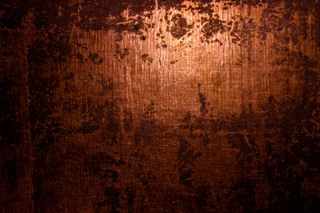 dark old scary rusty rough golden and copper metal surface texture/background for Halloween or haunted house games background/texture of wallの写真素材