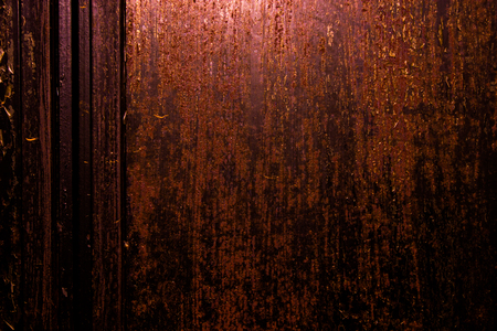 dark old scary rusty rough golden and copper metal surface texture/background for Halloween or haunted house games background/texture of wallの写真素材