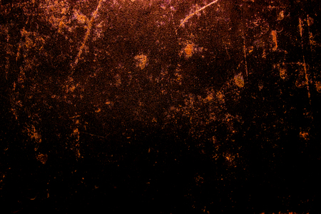 dark old scary rusty rough golden and copper metal surface texture/background for Halloween or haunted house games background/texture of wallの写真素材