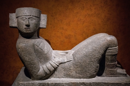 Chac-Mool is the name given to a type of Pre-Columbian Mesoamerican stone statue  The Chac-Mool depicts a human figure in a position of reclining with the head up and turned to one side, holding a tray over the stomach  の写真素材
