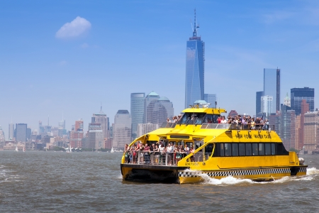 New York City Water Taxi in front of the NYC skyline on June 1st, 2013. New York Water Taxi provides the most exciting & entertaining NYC boat tours.のeditorial素材