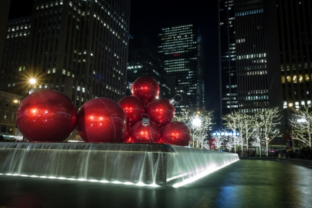 One of the most photographed holiday decorations on Sixth Avenue are the giant Christmas ornaments in front of 1251 Sixth Avenue building  Exxon Building  across from the Radio City Music Hall のeditorial素材
