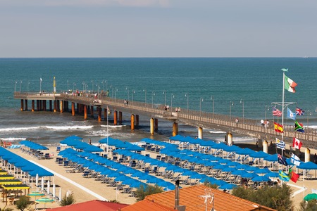 Pier at the luxurious Mediterranean beach on June 27, 2014 in Marina Di Pietrasanta, Italyのeditorial素材