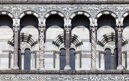 Details of the facade of the San Martino Cathedral in Lucca, built in 1070 to house one of the most renowned artifacts in Christendom, the Volto Santo, a venerated wooden corpus of a crucifix の写真素材