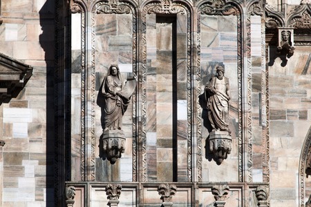 Milan cathedral is the third largest church in the world. It was begun by the Visconti family in 1386 and finished by Napoleon in 1805 more than four centuries later.の写真素材