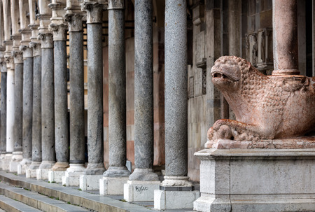 The columns of the Cremona's cathedral narthex stand on two lions in Verona marble. The left one is...