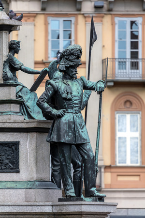 Statue of a mid-19th century Sardinian soldier at the side of the equestrian monument to the king Charles Albert of Sardinia in Piazza Carlo Alberto in Turin, sculpted by Carlo Marochetti in 1861.のeditorial素材