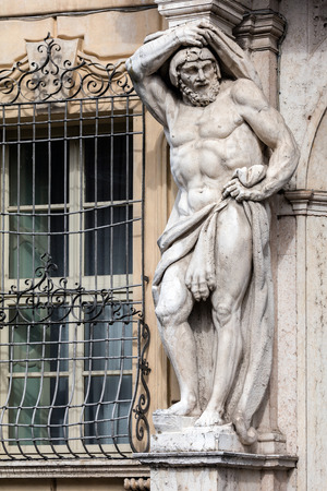 Statue of Hercules at the entrance to the 18th century Palazzo Vescovile (Bishops Palace) in the historical center of Mantua, Italyの写真素材