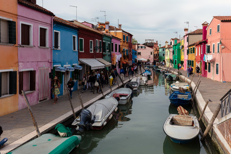 BURANO, ITALY - APRIL 30 2016: Burano's traditional industry is fishing. Legend has it that locals began painting their homes luminous colors so that the fishermen could see them even in thick fog.のeditorial素材