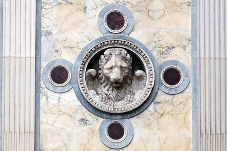 Lion of St. Mark on the facade of the medieval Scuola Grande di San Marco in Venice, Italyの写真素材