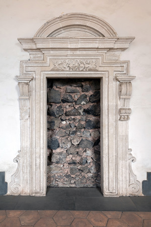 Doorway blocked with lava stone in the 16th century Benedictine Monastery of San Nicolo l'Arena in Catania, Sicily, Italyの写真素材