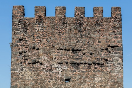 The Aci Castello's castle is situated on a ridge of lava, dominating the surrounding square. Built by the Normans from black lava stone between 1076 and 1081.のeditorial素材