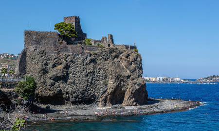 The Aci Castello's castle is situated on a ridge of lava, dominating the surrounding square. Built by the Normans from black lava stone between 1076 and 1081.のeditorial素材