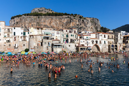 CEFALU, ITALY - AUGUST 20 2016: The city of Cefalu, the ancient Kephalodion - a Greek term that means "Head" and refers to the natural shape of the Rock which dominates the city.のeditorial素材