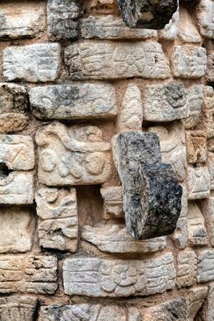 Mask of Chac, the Ancient Mayan god of rain and lightning in front of the Ossuary pyramid at the Chichen Itza archaeological site in Yucatan, Mexico.の写真素材